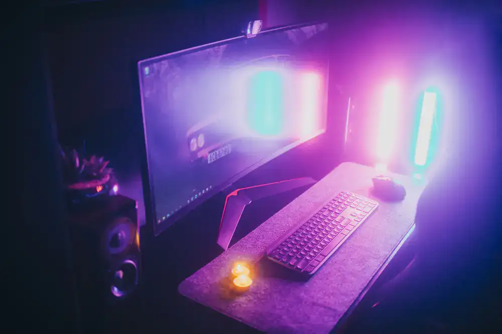 Key light and RGB accent lighting illuminating a desk setup