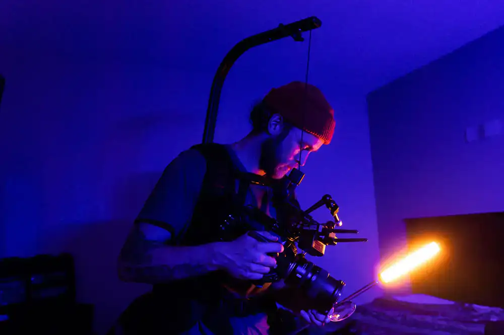 Technician adjusting studio lighting